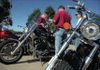 Robb Van Auken, from left, Ted Points and Bay Phommachak plan their route Saturday for the Wheels for Meals Poker Run in the Bill Eddy's Motorsports parking lot in Fayetteville.  All proceeds from the poker run benefited the Springdale and Fayetteville Meals on Wheels programs, which Points said was the main reason for choosing to participate in that event.