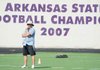 Fayetteville coach Daryl Patton watches during practice Aug. 14 at Harmon Field. The Bulldogs travel to Springdale to take on Shiloh Christian in an exhibition game today at the Field of Champions.