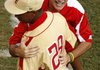 Warner Robins, Ga., Coach Randy Jones hugs pitcher Cortez Broughton after a 3-2 victory over Mercer Island, Wash., during the Little League World Series on Monday in South Williamsport, Pa.