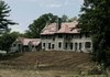 Workers renovate a 25-room mansion Monday in Englewood, N.J., at a Libyan-owned estate where Libyan leader Moammar Gadhafi wants to pitch his special air-conditioned tent on the lawn next month.