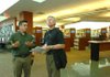 Bernie Hawke, library services director for Dunedin Public Libraries in New Zealand, right, takes a tour of the Fayetteville Public Library with Sam Palmer, facilities and sustainability director, Monday during Hawke's visit. Hawke traveled from New Zealand to tour the "greenest" libraries in North America, including Fayetteville's. 