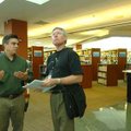 Bernie Hawke, library services director for Dunedin Public Libraries in New Zealand, right, takes a ...