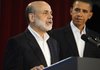 President Barack Obama looks on after announcing he is keeping Federal Reserve Board Chairman Ben Bernanke, left, for a second term, Tuesday.