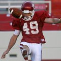 Arkansas junior punter Briton Forester kicks during practice Saturday at Donald W. Reynolds Razorbac...