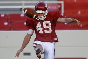 Arkansas junior punter Briton Forester kicks during practice Saturday at Donald W. Reynolds Razorback Stadium in Fayetteville.
