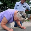 <b>Habitat groundbreaking</b>
Ray Smith watched as his wife, Eva, carved their names into the cemen...