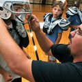 <b>A good fit</b>
Jake Szalapski, 7, center, of Bella Vista watched as Rocky House of Centerton fit...