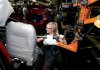 Ford worker Rashell Rule installs seats in a 2010 Ford Focus at the Wayne Stamping and Assembly Plant in Wayne, Mich., on Wednesday.