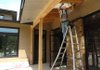 Donnie Perkins, with Roberts-McNutt roofing contractors, installs soffit Thursday afternoon on the new Jewish synagogue, Temple Shalom, at the intersection of Sang Avenue and Cleveland Street in Fayetteville. The synagogue is nearing completion but still has to raise $200,000 to complete the project.