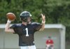 West Fork quarterback Isaac Muggy (1) passes during drills at practice Aug. 10 in West Fork.