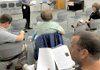 Bill Crawford looked over a list of frequently asked questions about flu viruses before the beginning of the Benton County Community Coalition's monthly meeting at the Rogers Public Library on Thursday.  