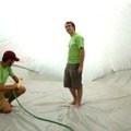 <b>Slide setup</b>
University of Arkansas students Cole Penick, left, and Jordan Scarbrough set up ...