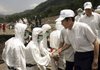 Taiwan's President Ma Ying-jeou shakes hands with soldiers working Thursday in the village of Hsinkai, which saw flooding and mudslides when Typhoon Morakot hit Taiwan.