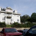 John La Tour talks Wednesday on his deck about his business of HogParking where he rents parking/tai...