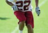 Arkansas freshman defensive back David Gordon moves through a footwork drill during practice Aug. 7 at the UA practice field.
