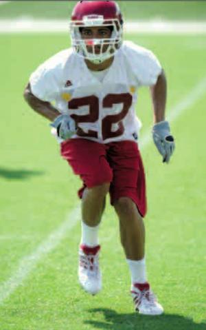 Arkansas freshman defensive back David Gordon moves through a footwork drill during practice Aug. 7 at the UA practice field.