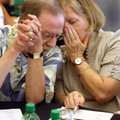 Russell Cox, of North Little Rock, listens to Lisa Whitbeck, of Little Rock, who was one of his two ...