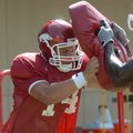Arkansas redshirt freshman Jim Youngblood is hoping the switch from quarterback to tight end will pa...