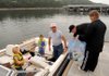 Bre Thompson, from left, Dalton Thompson, Ken Abrams, Barry Thompson and Marsha Abrams boarded a boat with their Secchi disk and equipment for a trip from Prairie Creek to Rocky Branch to take part in the fourth annual Secchi Day on Beaver Lake on Saturday.