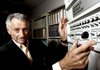 Internet pioneer Len Kleinrock poses last week next to an Interface Message Processor, a device used to develop the Internet.