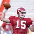 Arkansas sophomore quarterback Ryan Mallet warms up before practice Aug. 15 at Razorback Stadium.