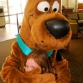 Lindsey Bowers, 7, got a hug from Scooby-Doo in the Pinnacle Promenade Food Pavilion in Rogers on Sa...