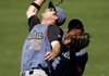 Tulsa first baseman Jeff Kindel (left) collides with second baseman Daniel Mayora before fielding a fly ball during the third inning of Sunday's game against Northwest Arkansas. 
