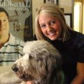 Sarah Eldridge, executive director of Pagnozzi Charities, sits with her Goldendoodle dog, Charlie, i...