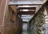 This passageway leads to the basement of the Basin Spring Bath House, which will serve as an office for Eureka Springs underground tours once repairs to the foundation and wall on the left are completed. 