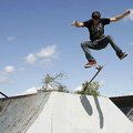 Barely aboard Andrew Cooper, 20, of Eureka Springs works to gain control of his board after jumping ...