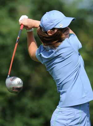 Fayetteville's Olivia Lavy watches her tee shot on the first hole during play Monday at Fayetteville Country Club. 