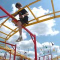 Steele Partridge, of Springdale, helps set up the Wacky Worm ride at the Washington County Fair in F...