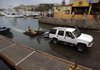 Tourists move their jet skies out of a marina Monday in Cabo San Lucas as Hurricane Jimena heads toward Mexico's Baja California peninsula. 