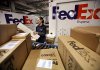 Rosa Santiago sorts packages at the FedEx Express Station in New York in December.