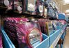 Locker Lites are displayed as part of a back-to-school display at a Wal-Mart store in Rogers. The decorative item was invented by 12-year-old Blair Breazeale.