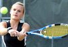 Bentonville's Oksana Hillyer returned a serve from Fort Smith Northside's Madison Coleman during a singles match Tuesday at Kingsdale Tennis Center in Bella Vista. 
