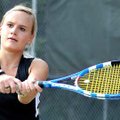 Bentonville's Oksana Hillyer returned a serve from Fort Smith Northside's Madison Coleman during a s...