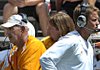 Tennessee head coach Lane Kiffin, right, walks past his father and defensive coordinator Monte Kiffin during an NCAA college football scrimmage at Neyland Stadium on Saturday, Aug. 22, 2009