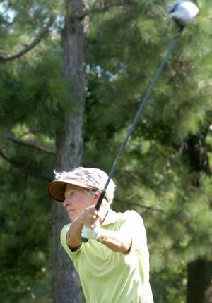 Sharon Wilson tees off on No. 10 Tuesday during the first round of the Fayetteville Country Club's Stroke Play Tournament. 