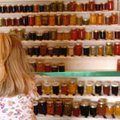 Lauren Horn, 4, looks for her siblings' preserved food entries Wednesday at the junior food preserva...