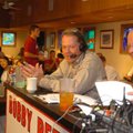 Arkansas head coach Bobby Petrino, left, talks during his radio show with host Chuck Barrett Wednesd...