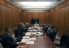 Arkansas Lottery Commission Chairman Ray Thornton (center) meets with commission members Wednesday before interviewing Michael Hyde of Benton for the job of internal auditor for the lottery.