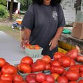 <b>Tomatoes galore</b>
Anita Aquino of Bentonville organized tomatoes at her stand on the corner of...