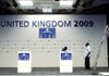 Workers prepare a stage Friday for briefings by G-20 finance ministers at the Queen Elizabeth II Conference Centre in London.