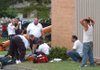 Workers with Central Emergency Medical Service and the Fayetteville Fire Department give CPR to a man who was shocked when his elevated bucket lift hit a power line Thursday at Trinity United Methodist Church at the intersection of Garland Avenue and Sycamore Street in Fayetteville. A crew with TLC Construction was working on the roof when the accident happened.