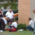 Workers with Central Emergency Medical Service and the Fayetteville Fire Department give CPR to a ma...