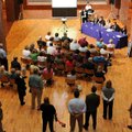 A panel of experts speaks during a discussion on the economic impact of a new high school Thursday a...