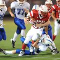 Ramay Junior High tailback Brice Gahagans (28) is tackled by Woodland Junior High free safety Ryan S...