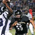 <b>Tigers 42, Wampus Cats 0</b>
Bentonville's Chase Gogel prepared to tackle Conway's Xavier Acklin...