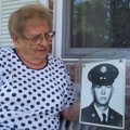 Randi Knebel with a photo of her son, Thomas K. Knebel, taken shortly before this plane crashed.